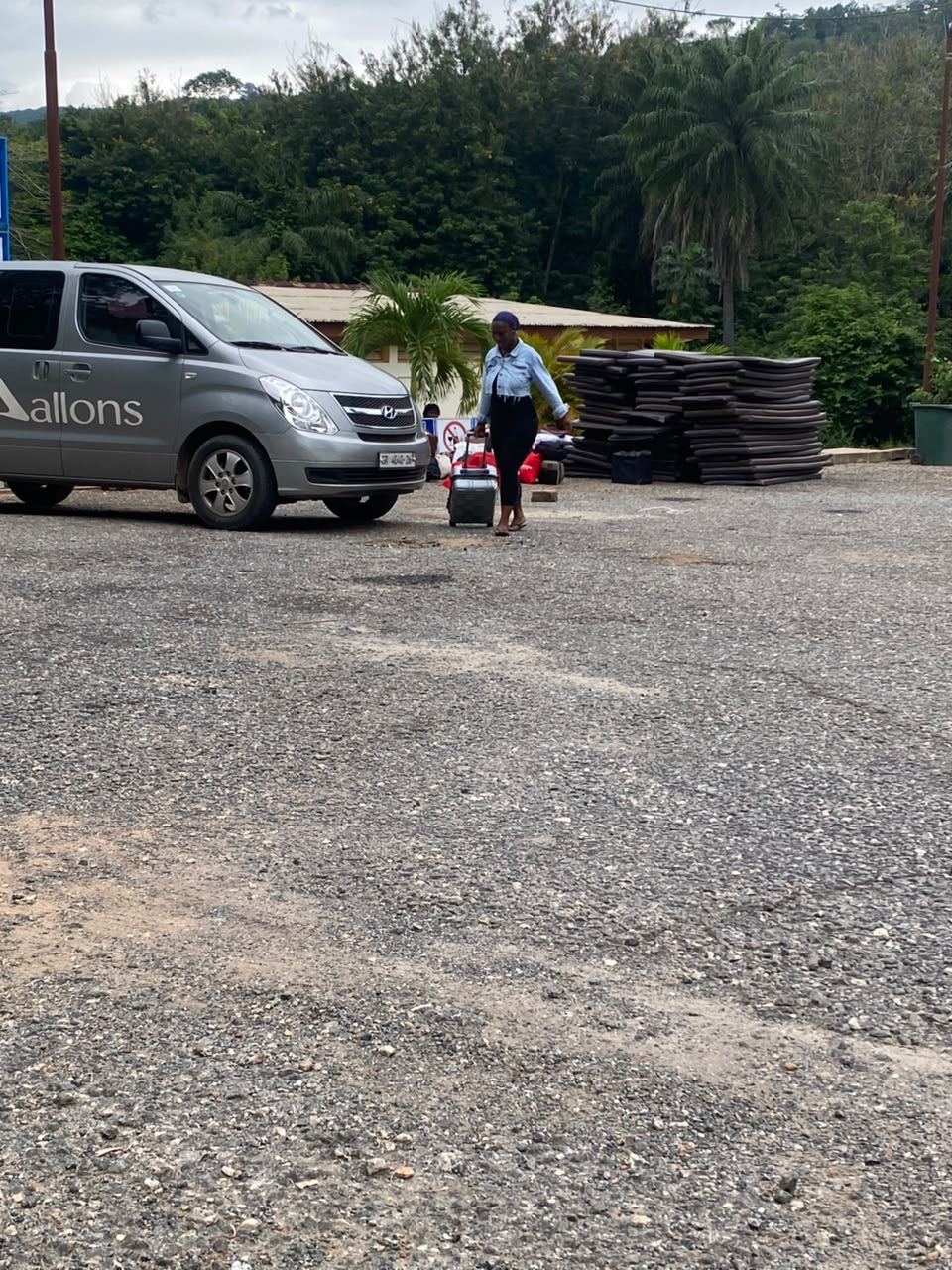 Passenger with luggage being met by an Allons van